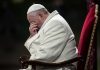 Vatican Document STUNS with Gay Blessing Approval Pope sitting with his head bowed and hand covering his face