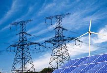 How Power Grid Is Draining Your Wallet Power lines, solar panels, and wind turbine against sky.