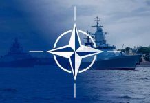 NATO emblem overlaying naval ships in the ocean.