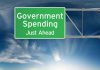 Green road sign: Government Spending Just Ahead.