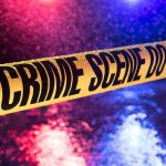 Trusted Companion Became Her Killer Yellow crime scene tape with police lights in background.