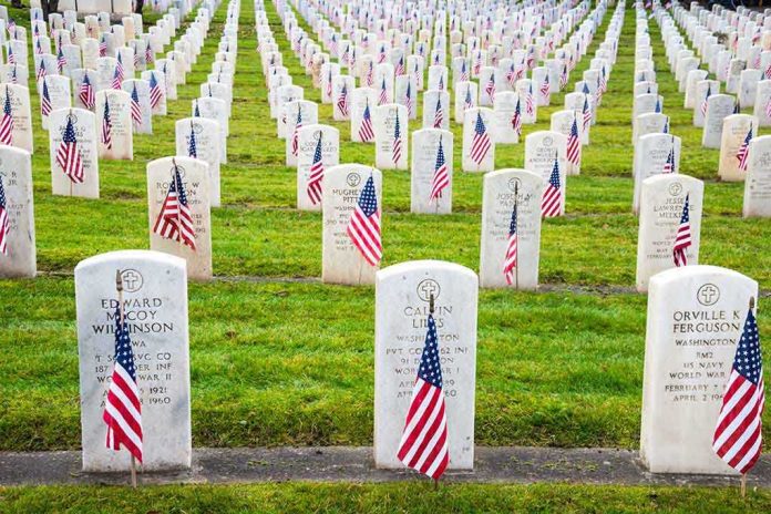 shutterstock_163155476.jpg Rows of grave markers adorned with American flags in a military cemetery