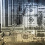 Architectural columns with a background of U.S. currency