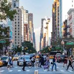 City street with pedestrian crossing and traffic.