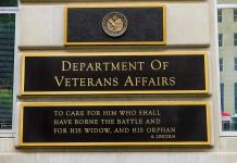 VA Defies Supreme Court–Veterans Sue! Department of Veterans Affairs building sign with quote.
