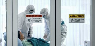 Hantavirus Outbreak: Luxury Cruise Turns Into Floating Quarantine Healthcare workers in protective gear in quarantine room.