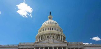 Investigation Looms: Political Tensions Rise Over Fraud Accusations U.S. Capitol building against a clear blue sky.