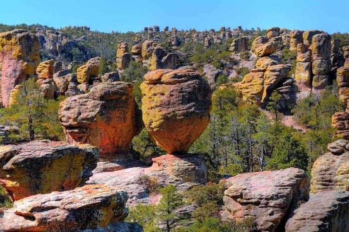shutterstock_37134283 Unique rock formations surrounded by greenery under a clear blue sky
