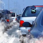 Clean-Air Promise Turned Into a Public Health Crisis Traffic jam with cars emitting exhaust fumes on a city road