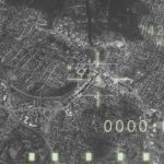 Aerial view through night vision targeting display.