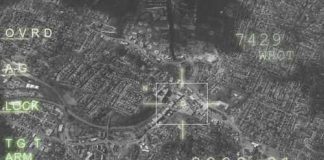 Trump Expands Fight Against “Narco-Terror” Groups Aerial view through night vision targeting display.