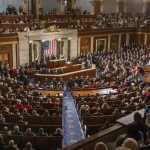 Washington Divided Over China AI Sales People in a large government assembly hall meeting