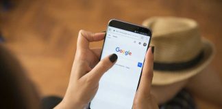 EU Judges Drop A Bomb On Google Person using smartphone with Google search page displayed