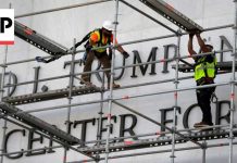 Crews prepare to remove Donald Trump's name from the Kennedy Center