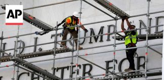 Crews prepare to remove Donald Trump's name from the Kennedy Center