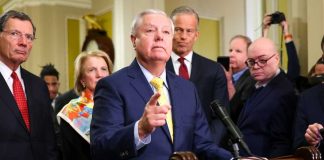 Families Push DHS for Action A group of government officials at a press conference with one speaking into a microphone