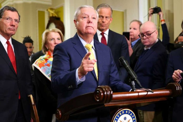 shutterstock_2585386113 A group of government officials at a press conference with one speaking into a microphone