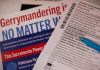Close-up of election materials including a ballot and informational flyers