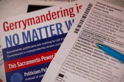 Close-up of election materials including a ballot and informational flyers