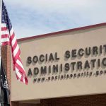 Trustees Warn Social Security Reserves Social Security Administration building with American flag outside.