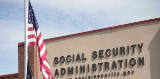 Trustees Warn Social Security Reserves Social Security Administration building with American flag outside.