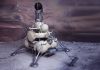 Soviet-style lunar lander with antennas on a rocky surface