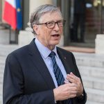 The AI Voice Scam That’s Fooling Families Across America A man in a suit speaking outdoors near a building