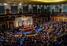 legislative chamber filled with seated members during a session