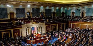 legislative chamber filled with seated members during a session