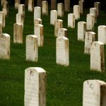 Pentagon’s Iran War Death Toll Sparks New Questions Rows of gravestones in a cemetery surrounded by green grass