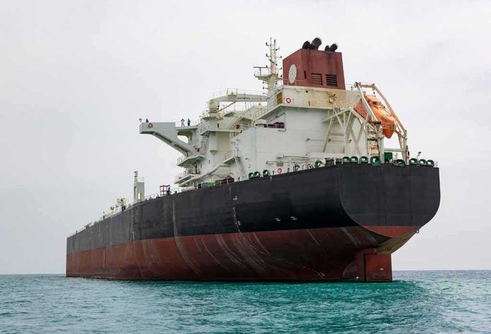shutterstock_1985991914-1 Large oil tanker anchored in calm sea