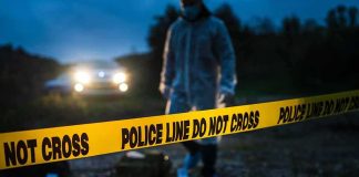 Irish Police Foil Major Border Car Bomb crime scene with yellow police line tape at night