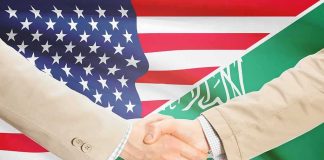 Saudi Enrichment? Washington Plays With Fire Handshake between two people over U.S. and Saudi flags