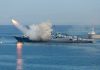 Warship launching a missile at sea