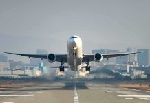 An airplane taking off from an airport runway