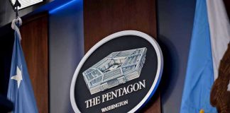 Pentagon Fires Stars and Stripes Leaders The Pentagon emblem between two flags.