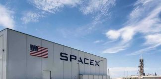 A Land Deal That Could Change SpaceX Forever SpaceX hangar beside launch pad under blue sky