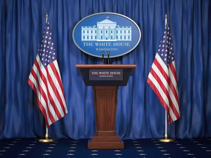 shutterstock_1159933525 White House press podium with microphones and two American flags