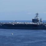 Nine Months at Sea Was “Not Nearly Long Enough” Aircraft carrier at sea with crew lining the deck
