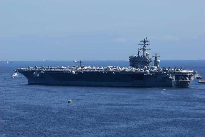shutterstock_1340097212 Aircraft carrier at sea with crew lining the deck