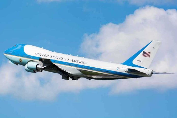 shutterstock_1477995563 Air Force One aircraft ascending against a blue sky