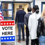 Voters standing in line at a polling place entrance