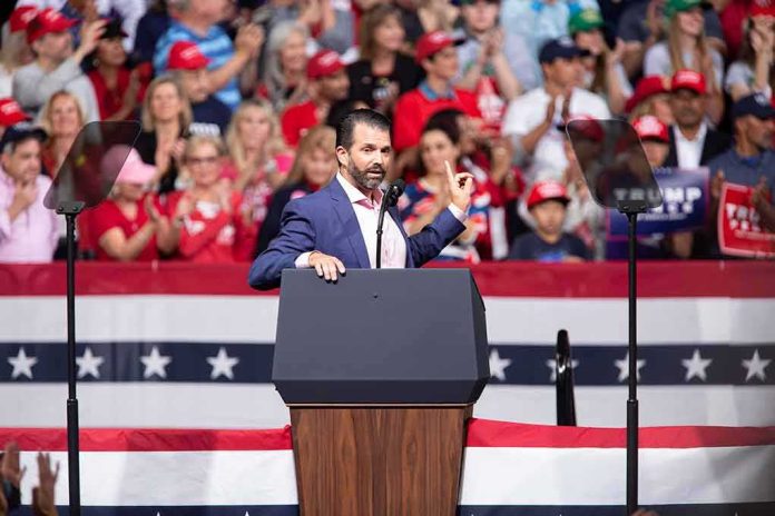 Speaker at podium addressing a rally crowd