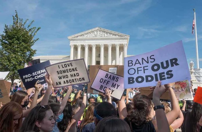 Protesters with signs outside a neoclassical courthouse