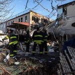 Man Hospitalized After Manhattan Lobby Fire Firefighters assess damage at a collapsed residential building