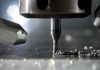 CNC milling bit cutting metal surface