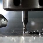 CNC milling bit cutting metal surface