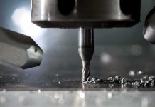 CNC milling bit cutting metal surface