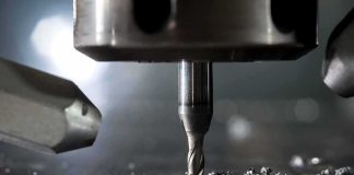 Tungsten Prices Hit Record Highs CNC milling bit cutting metal surface
