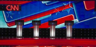 CNN Showdown Over Explosive Hamas Praise Debate stage with four podiums and colorful star backdrop